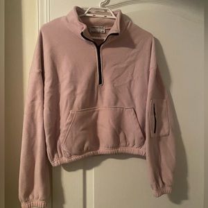 Cropped quarter zip with arm zipper pocket